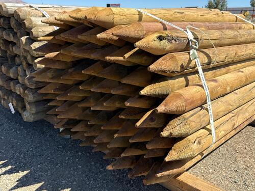 Bundle of 6 ft Pressure Treated Round Wood Fence Posts, 4-in Diameter, Pointed Ends