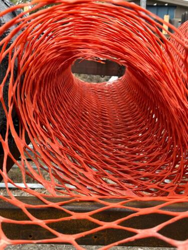Multiple Rolls Of Orange Construction Netting Barrier - 2