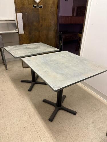 Two Metal Covered Restaurant Tables with X-Base